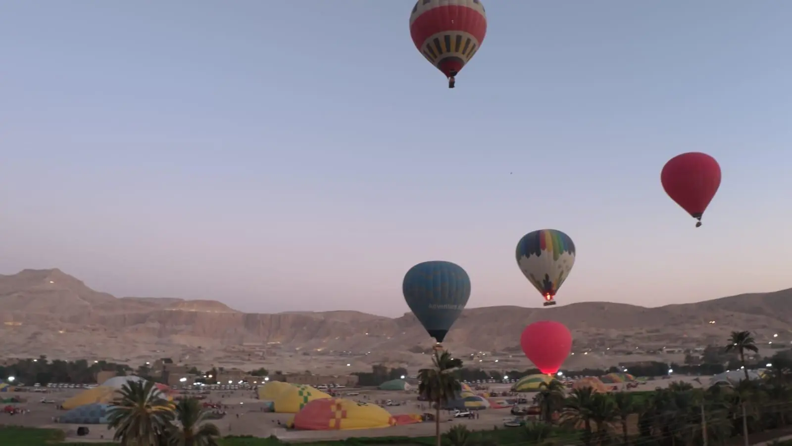 Hot air balloons over the Valley of the Kings at sunrise